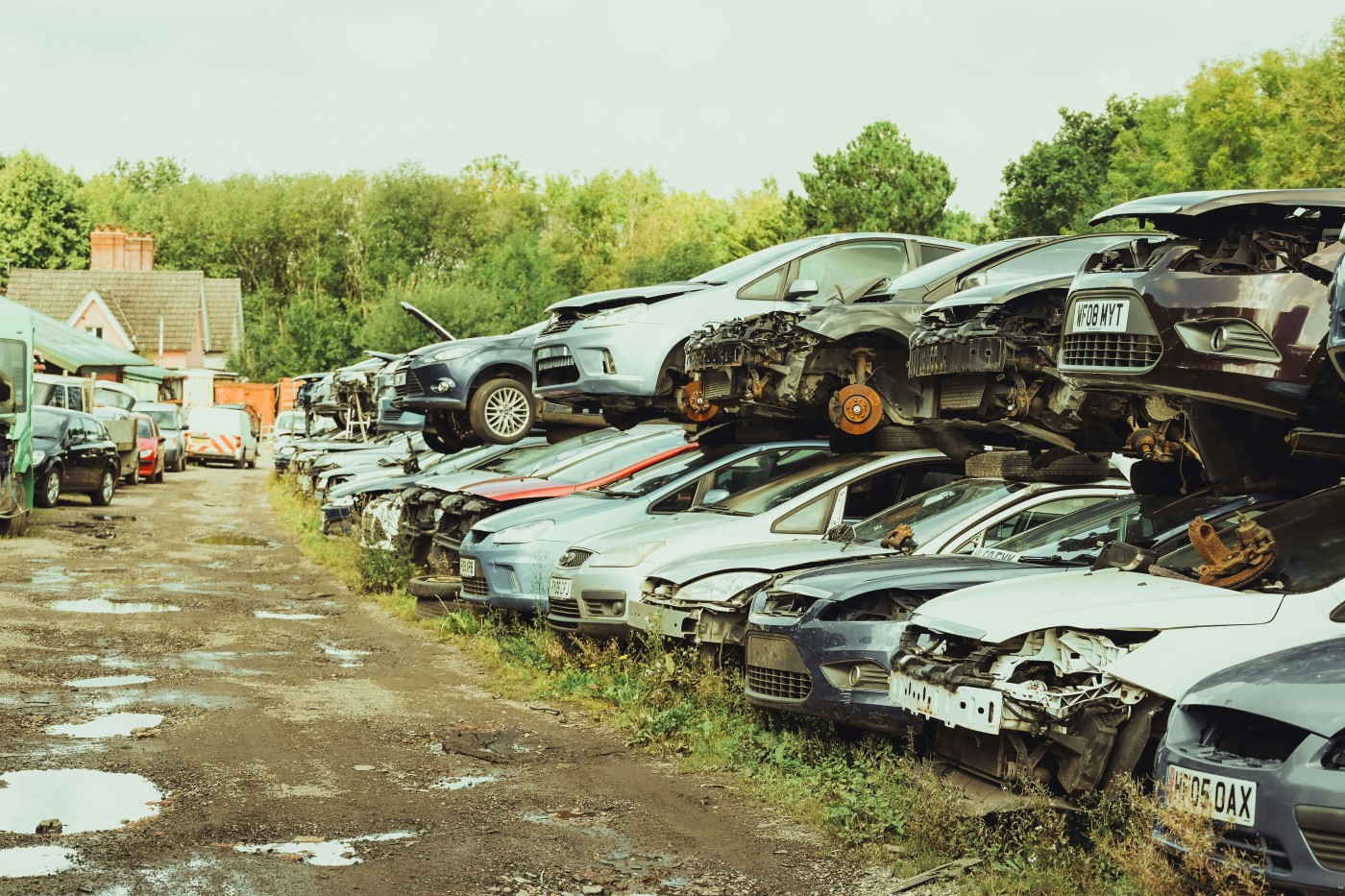 A scrap yard with various popular car brands.